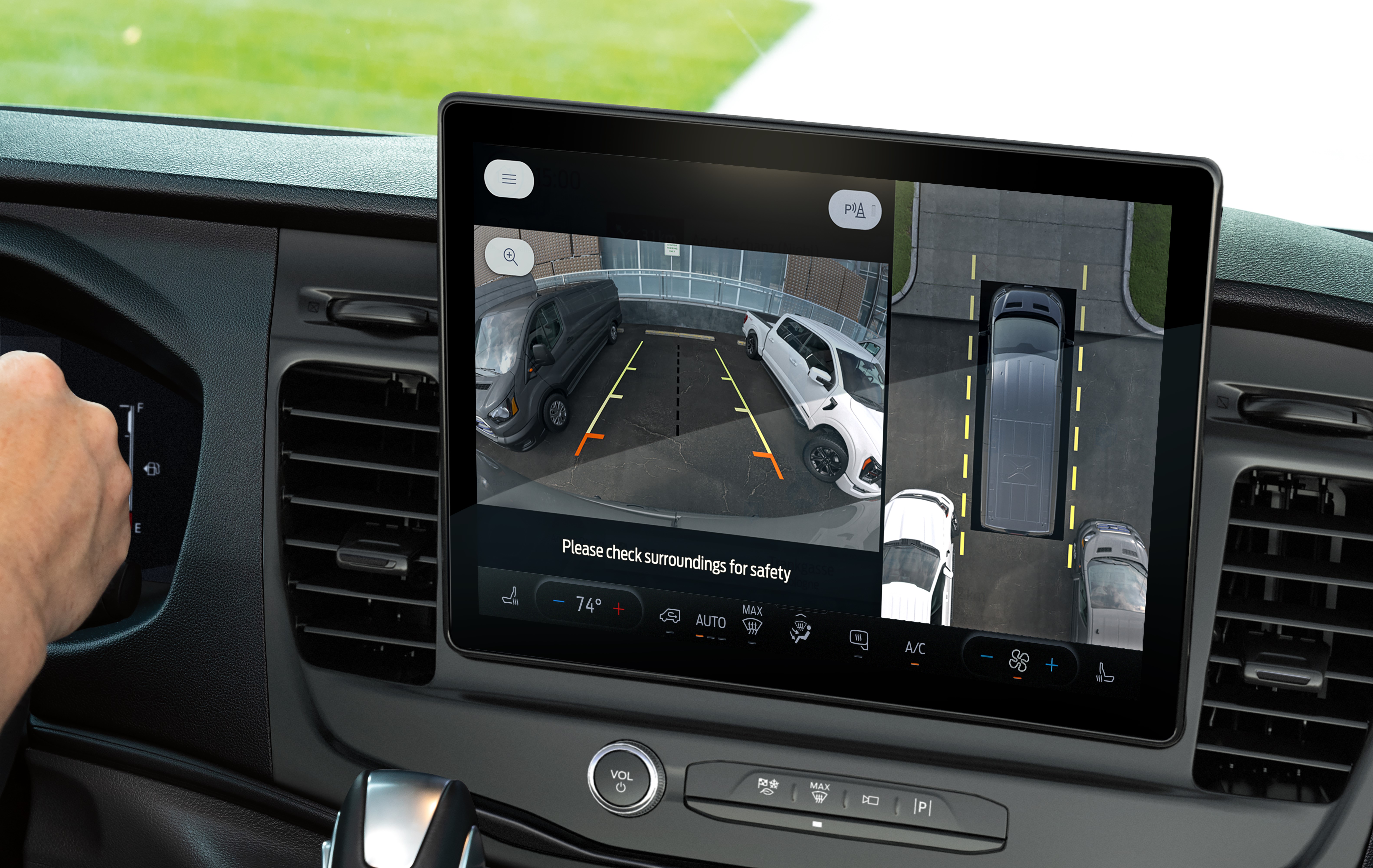 A 12-inch display screen inside of a Ford Transit shows a backup camera.